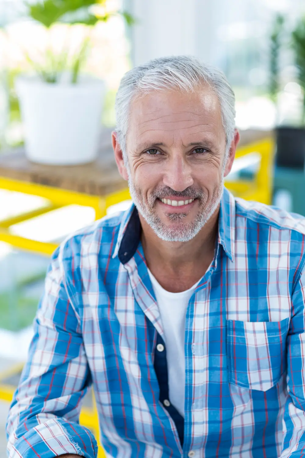 Happy middle-aged man smiling outdoors